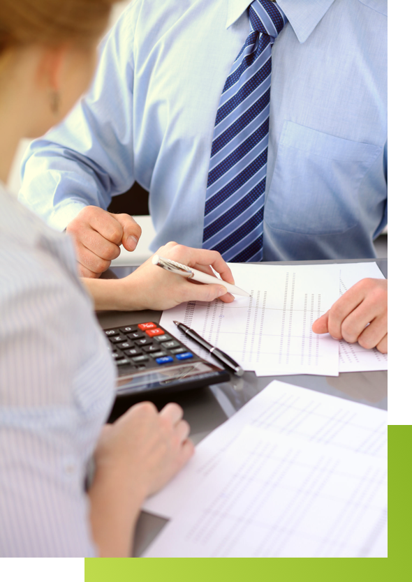 NCQA HEDIS Compliance Auditing 3 Two business professionals reviewing paperwork for an NCQA HEDIS Audit