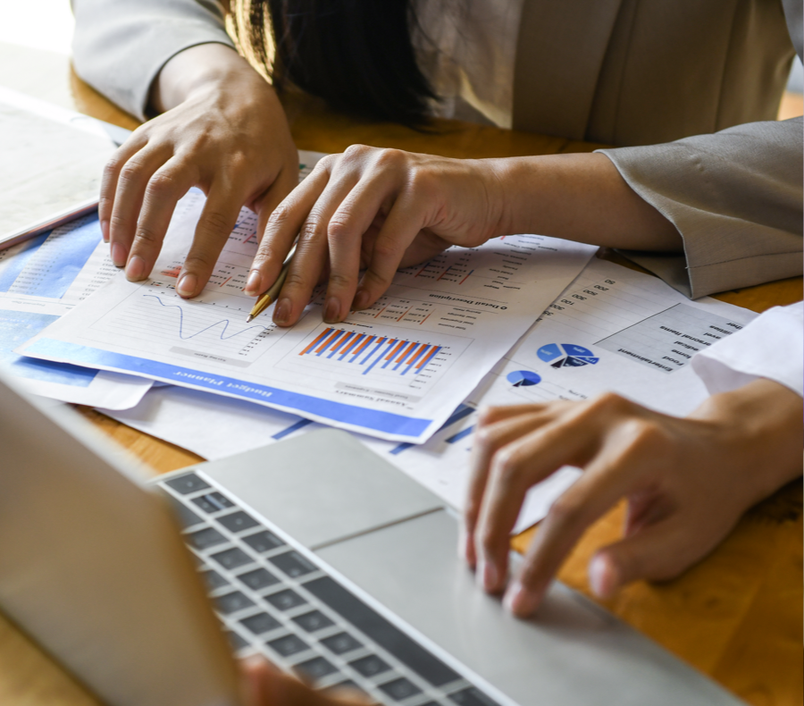 NCQA HEDIS Compliance Auditing 4 Two people reviewing paperwork about the HEDIS Audit